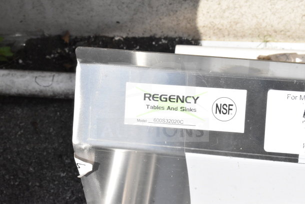 "Regency 600S32020C commercial L-shaped sink, no legs, scratch and dent condition, dual drain boards. NSF label shown."