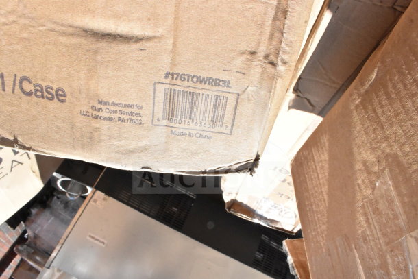 Cardboard box labeled for Clark Core Services, Lancaster, PA. Barcode visible, made in China. Contains scratch and dent items.