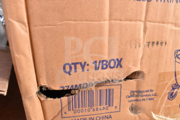 Cardboard box labeled "QTY: 1/BOX," slightly damaged. Auction includes 14 scratch-and-dent items, like melamine plates.
