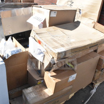 Stack of 12 scratch and dent items on pallets, including a juice dispenser and a motor, labeled with auction tag 10333.