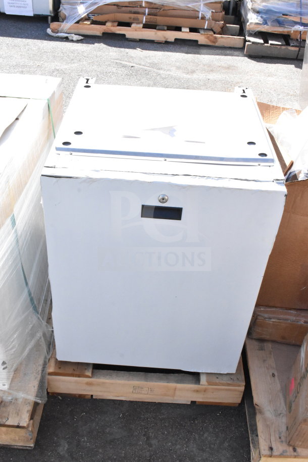 Brand new commercial cabinet with slight scratches and dents, shown on pallet. Features a lock and handles.