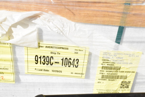 Brand new security case with scratches and dents, model 35352944C052. Shipping labels and codes visible.