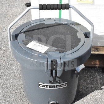 Brand new, scratch and dent, CaterGator CCG20CHR charcoal 20 Qt. rotomolded outdoor cooler with label visible.