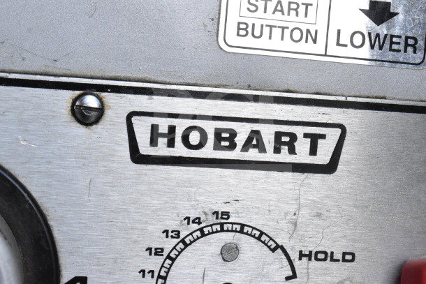 Hobart M-802 mixer control panel with logo and start button. Features speed dial and stainless steel surface.