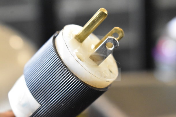 Close-up image of a three-prong electrical plug, suitable for a Hobart H 600 commercial mixer.