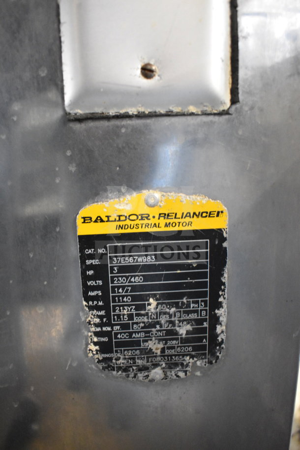Commercial floor-style meat grinder with Baldor Reliance industrial motor, 230/460 volts, 3 phase, visible on worn tag.