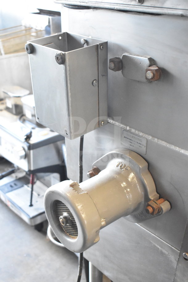 Hobart 4246 HD commercial meat grinder, floor style, 208 volts, 3 phase. Durable metal construction, visible warning label.