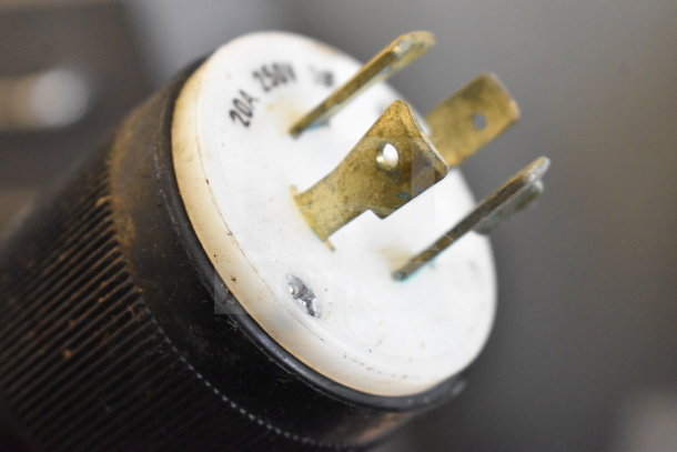 Close-up of a 2017 Cuppone PZF/30DS-B6-US dough press power plug, showing 20A-250V marking.