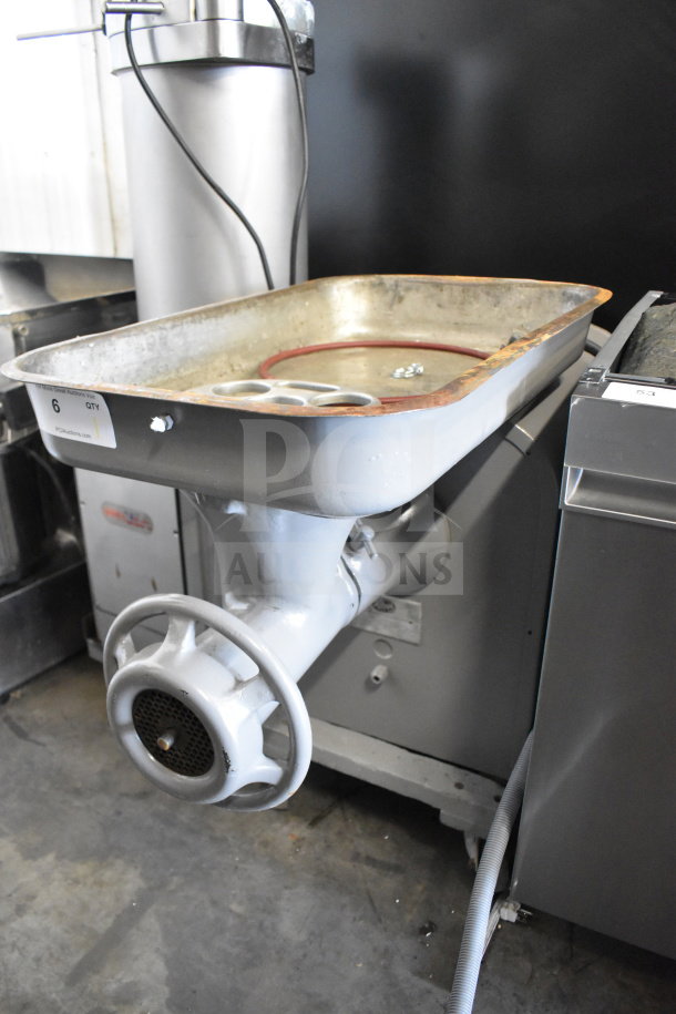 Hobart 4442 Commercial Meat Grinder, 220 Volts, 3 Phase, used condition. Large tray, visible wear, sturdy build.