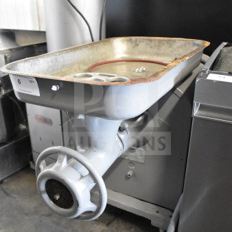 Hobart 4442 Commercial Meat Grinder, 220 Volts, 3 Phase, used condition. Large tray, visible wear, sturdy build.