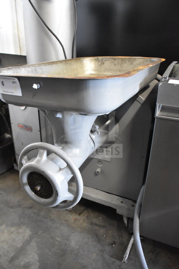 Hobart 4442 commercial meat grinder, 220V, 3-phase, used condition with visible markings, large feeding tray.