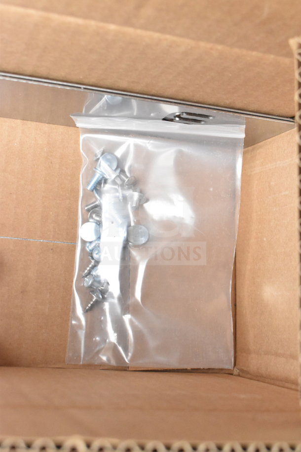 Bag of screws in a cardboard box, likely for assembly of the Hatco GRHD-4PD dual shelf merchandiser.