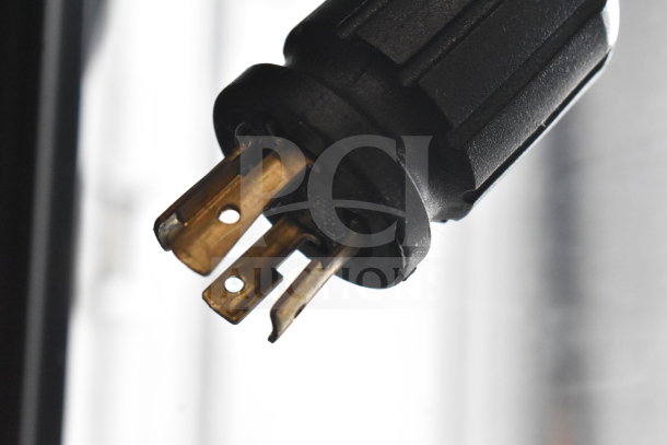 Close-up of a power plug for the 2019 True GDM-72F-HC freezer, showing its 115/208-230 volts connection capability.