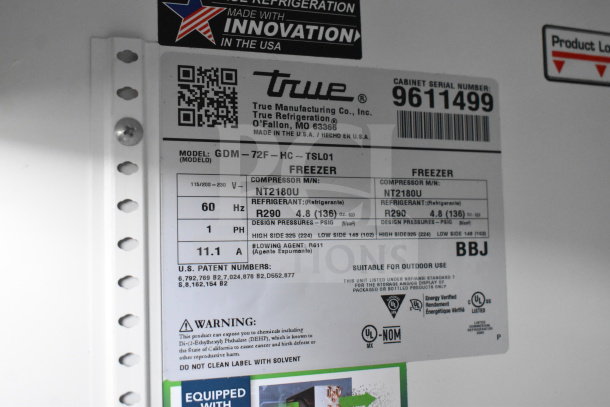 True GDM-72F-HC 3 Door Reach In Freezer Merchandiser, tested and working, 115/208-230 Volts, 1 Phase. Model info visible.