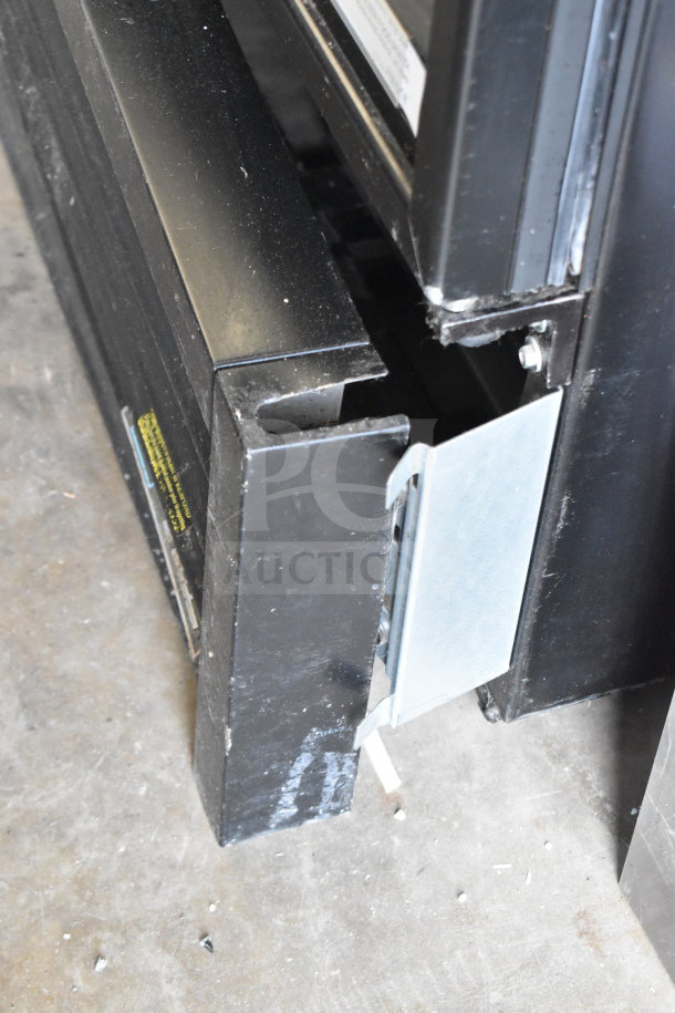 2019 True GDM-72F-HC Commercial 3 Door Freezer Merchandiser, black exterior, tested and working. Visible corner and hinge detail.