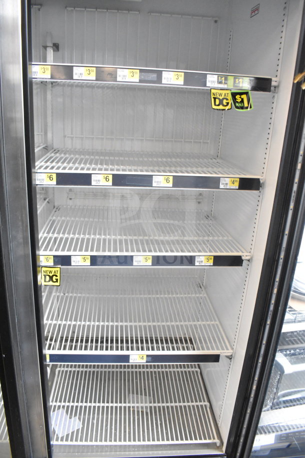 2019 True GDM-72F-HC 3-door reach-in freezer, empty shelves, clear glass, price tags visible, tested and working.