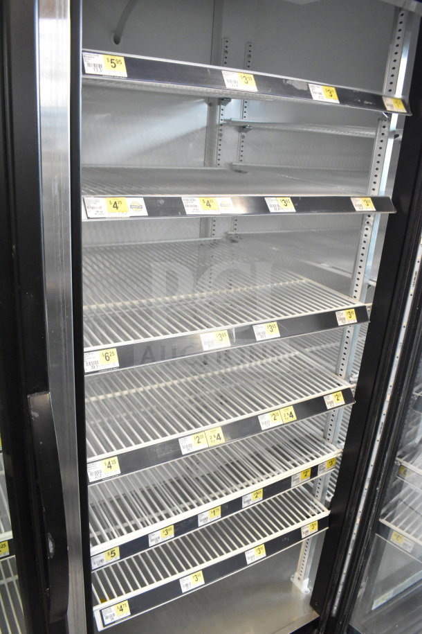 2019 True GDM-72-HC commercial 3-door reach-in cooler, tested and working, empty shelves, price labels visible, 115V.