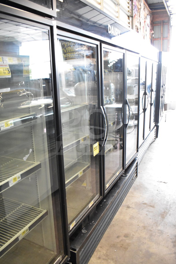 2019 True GDM-72-HC 3 Door Reach-In Cooler, 115V, tested and working. Features glass doors, black frame, visible shelves.
