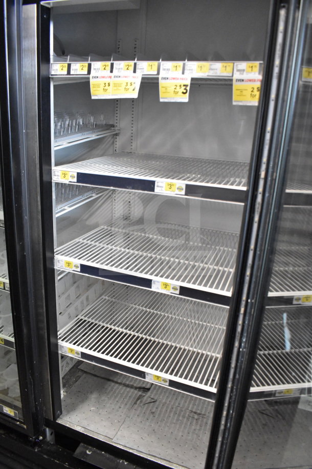 2019 True GDM-72-HC commercial 3-door reach-in cooler merchandiser, 115V, 1 phase, tested and working, features glass doors.