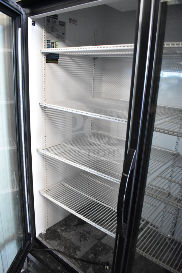 2018 True GDM-49-HC Commercial 2 Door Cooler, white shelves, tested, working, 115V, 1 phase, interior view, labels visible.
