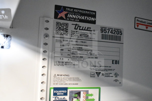 2018 True GDM-49-HC commercial cooler, 2 doors, 115 volts, tested and working. Label shows model, refrigerant, and specifications.