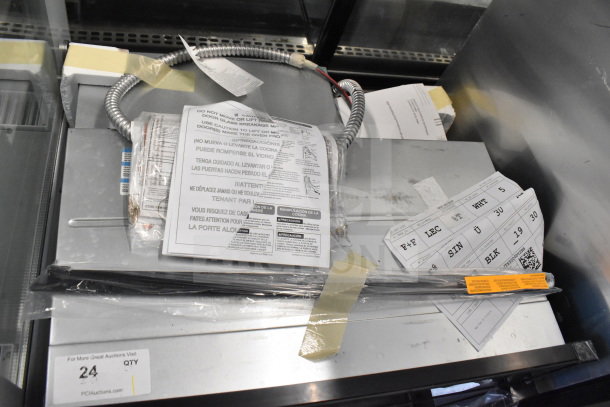 BRAND NEW GE JTS5000DV2BB convection oven. Scratch and dent condition, includes visible labels and paperwork. Broken glass noted.