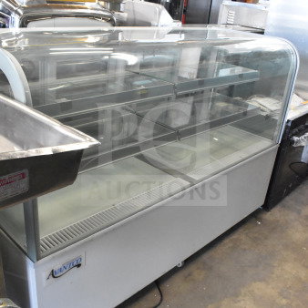 Brand new Avantco 193BC72HCW 72" refrigerated bakery display case with curved glass, white finish, minor scratches, 110-120V.