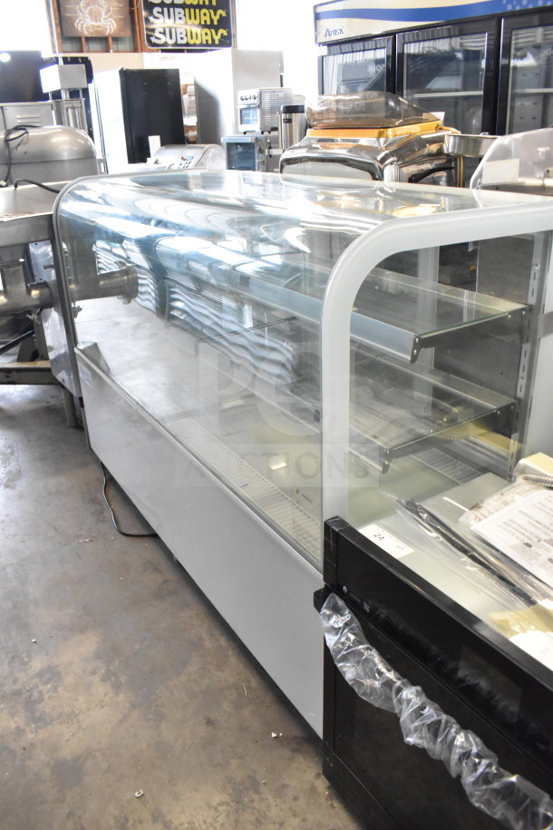 Brand new Avantco 193BC72HCW 72" curved glass refrigerated bakery display case, white, 110-120V, 1 Phase. Scratch and dent.
