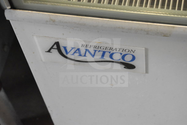 Brand new Avantco 193BC72HCW 72" curved glass white bakery display case. Some scratches and dents visible. Model label shown.