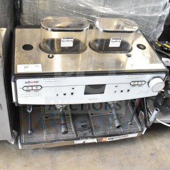 Schaerer Barista commercial 2-group espresso machine with 2 hoppers, 2 portafilters; visible labels and controls.