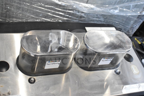 Schaerer Barista espresso machine with two stainless steel hoppers, two portafilters, labeled for functionality.