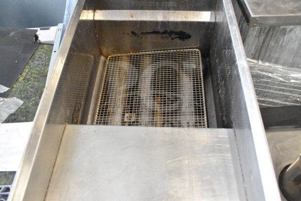 Bakers Pride commercial deep fat fryer, natural gas, 114,000 BTU, stainless steel, grid interior, used condition.
