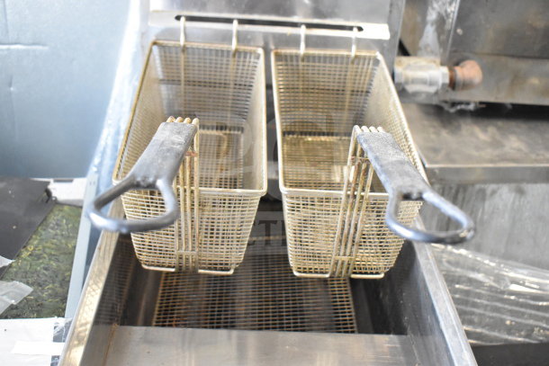 Bakers Pride commercial deep fat fryer, natural gas, 114,000 BTU, with dual baskets and metal handles, in good condition.