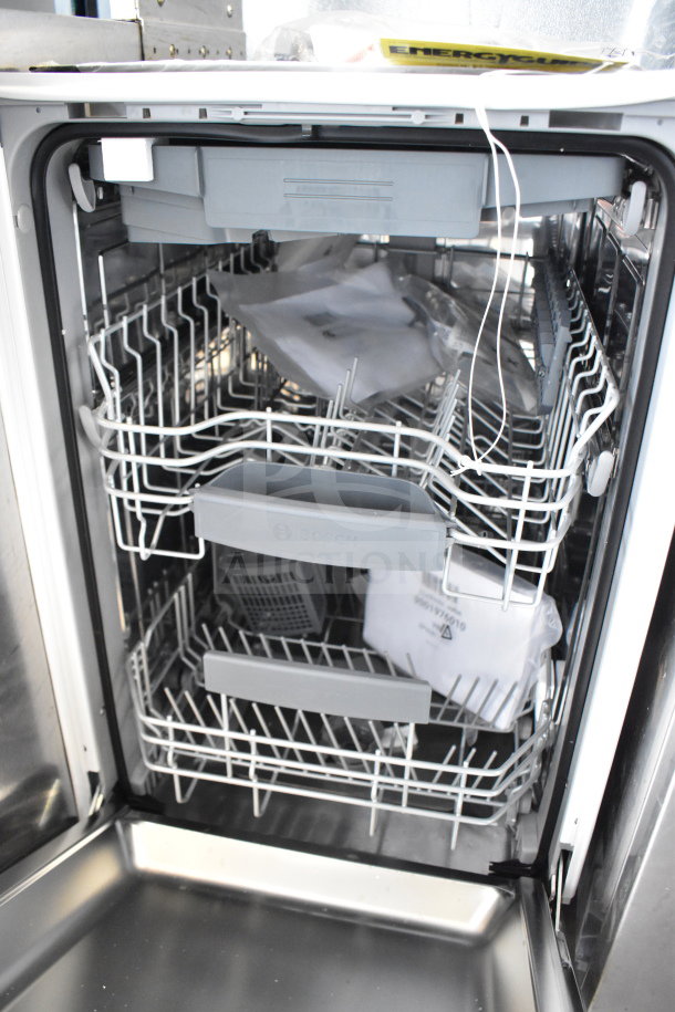 Bosch SPV68C73UC/44 undercounter dishwasher, stainless steel, 120V, clean interior, visible racks, and instruction packet.