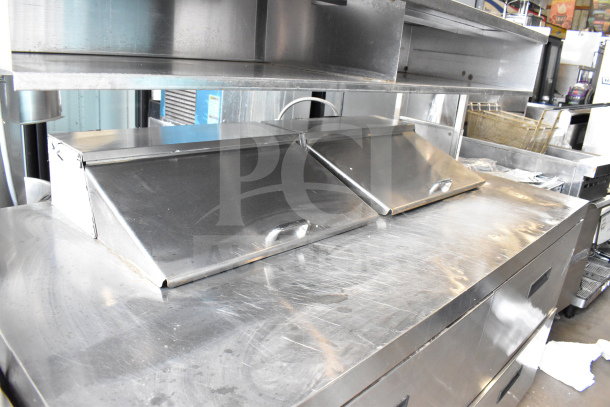 2017 Delfield UCD4464N-12-DD5 commercial sandwich salad prep table with four drawers, over-shelf, and stainless steel finish.