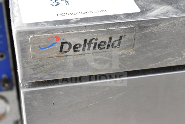 2017 Delfield UCD4464N-12-DD5 prep table, visible brand label, stainless steel condition, PCI Auctions sticker.