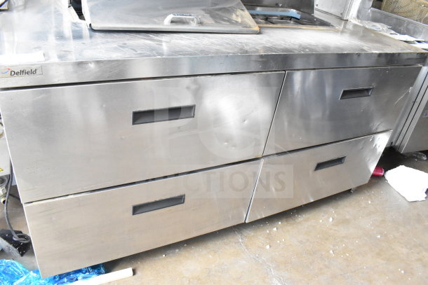 2017 Delfield UCD4464N-12-DD5 commercial prep table with 4 drawers, stainless steel, shows minor wear, model visible, 115V.