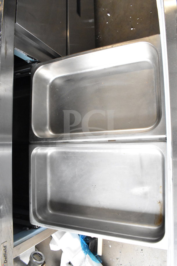 2017 Delfield UCD4464N-12-DD5 Sandwich Prep Table with open stainless steel drawers, visible Delfield label.