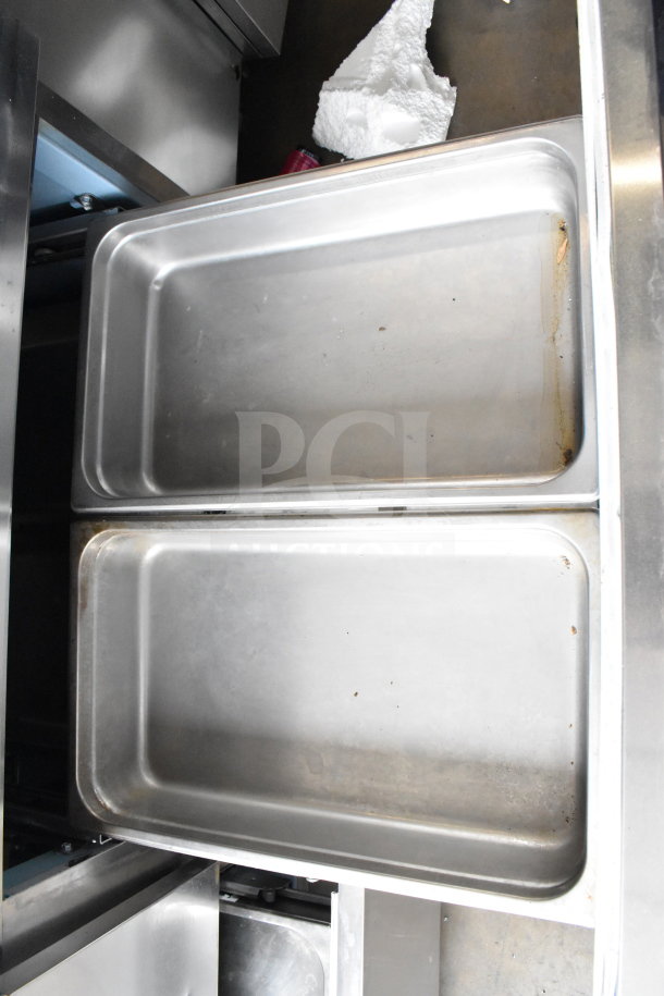 2017 Delfield UCD4464N-12-DD5 prep table, stainless steel drawers, bain marie top, good condition.