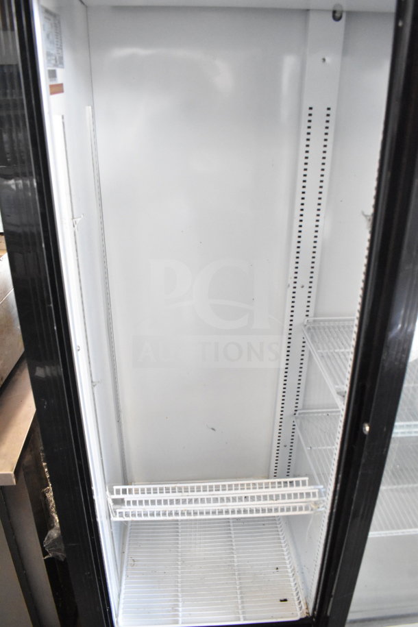 Bison SGM-35 commercial 2-door reach-in cooler. 115V, 1 Phase. Features adjustable shelves, clean interior. Good condition.