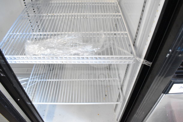 Bison SGM-35 commercial 2-door reach-in cooler merchandiser. Features wire shelves, 115 volts, 1 phase, clean interior.