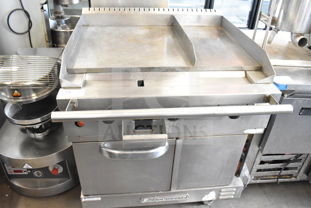 Southbend commercial flat top griddle with convection oven, stainless steel, on commercial casters, good condition.