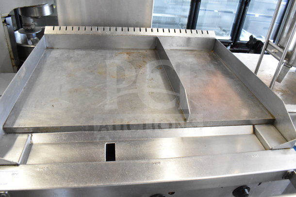 Southbend commercial flat top griddle with convection oven, stainless steel, on commercial casters; used condition.
