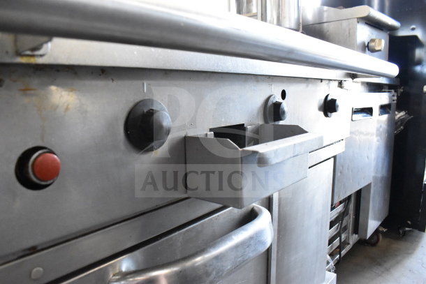 Southbend commercial flat top griddle with convection oven, stainless steel, on casters, in good used condition.