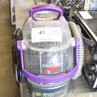 Bissell 2458 SpotClean PetPro Vacuum Cleaner. Purple handle, visible tank, includes cord and hose. Model label shown.