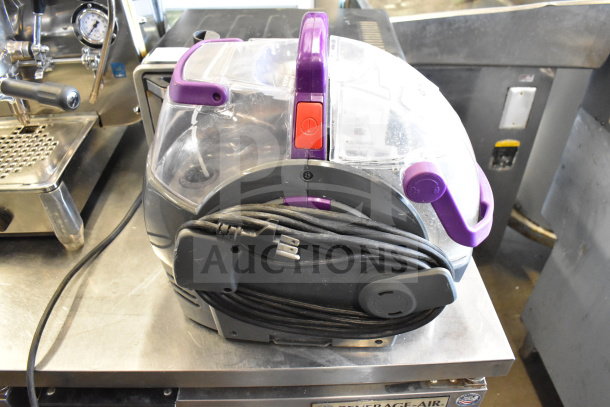 Bissell 2458 SpotClean PetPro Vacuum Cleaner with power cord wrapped. Features purple accents and 115V, 1 phase power.