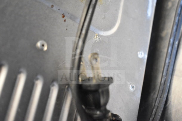 Cuisinart TOB-40 countertop toaster oven plug, slight wear, 120 volts, 1 phase. Close-up showing cord and plug connection.