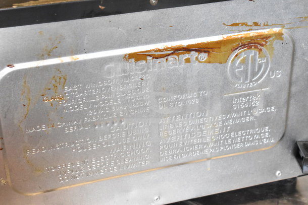 Cuisinart TOB-40 countertop toaster oven label showing model, 120V, 1 phase, with rust and wear visible.