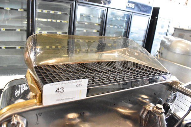 Faema E61 2-group espresso machine with 2 portafilters, steam wand, stainless steel, minor wear, auction label attached.