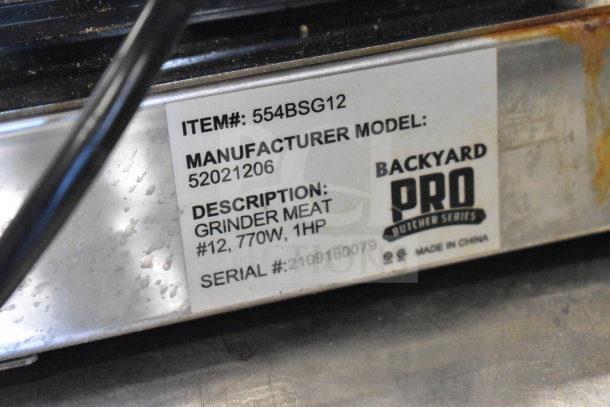 Backyard Pro Butcher Series #12 electric meat grinder, model 554BSG12, shown with item and serial numbers visible.